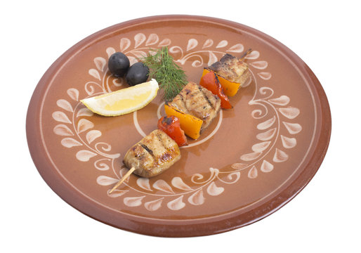 Sturgeon shish kebab with vegetables.
