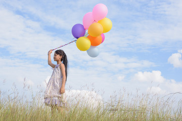 Happy girl with colorful balloons,positive emotion, enjoying summer. The concept of freedom and refreshing relaxing.