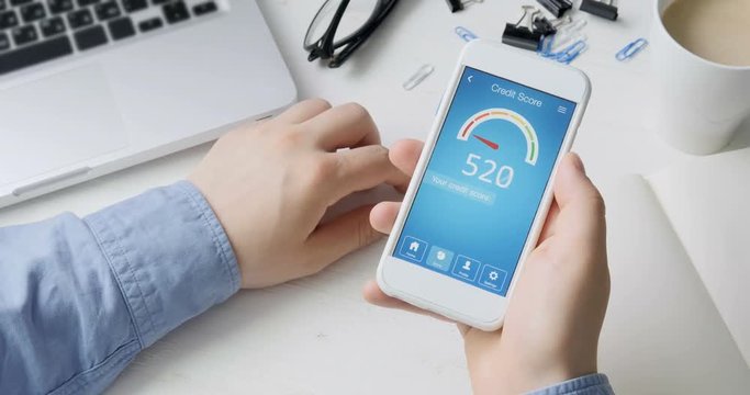 Checking credit score on smartphone using application. The result is VERY POOR