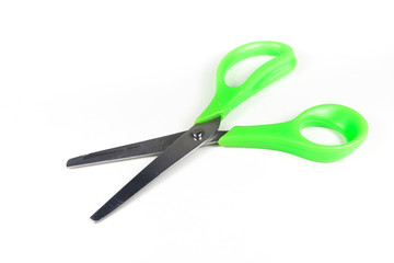 Green scissors isolated on a white background.