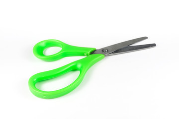 Green scissors isolated on a white background.