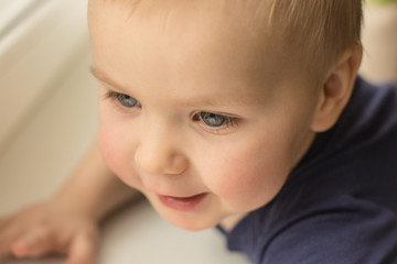 Beautiful little child with wet hair smiling close up portrait