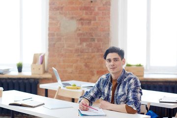 Intellectual employee taking course of study in technical school