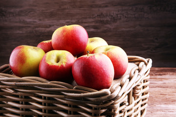 Ripe red apples on wooden background summer concept