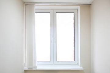 White metal-plastic window in modern apartment