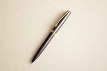 Classy metallic pen on white table