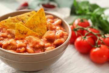 Bowl with delicious turkey chili on table