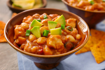 Bowl with delicious turkey chili on table