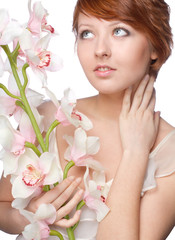 beautiful girl with big orchid on white