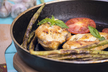 Fried chicken meat and asparagus