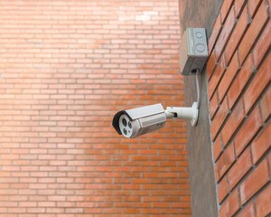 CCTV Security Camera. Security camera mounted on the outdoors brick wall