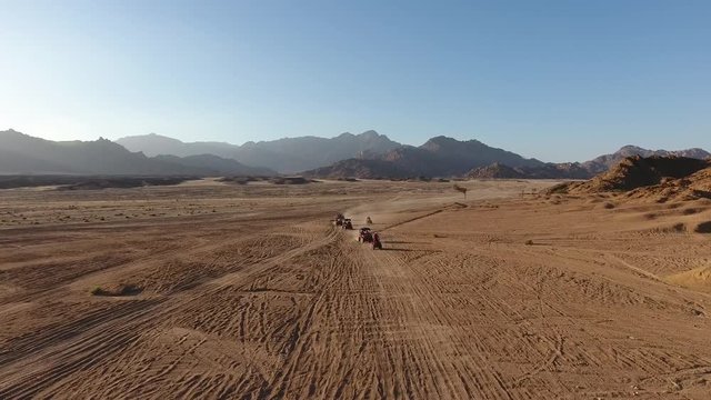 On ATVs in the desert
