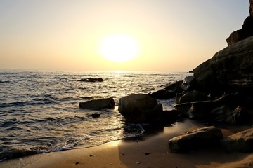 Beautifull Sunset over the sea and rocks. Greece island Kos, summertime.