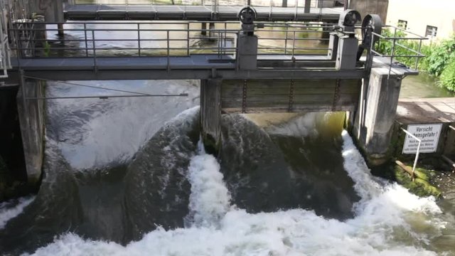 Small weir of the Regnitz river showing the power of water, Bamberg, Germany