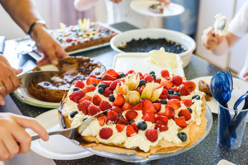 Family celebration with sweet cakes.