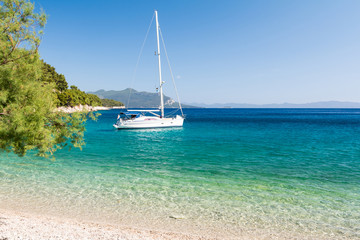beautiful beach with yacht on dalmatian island, Dalmatia, Croatia