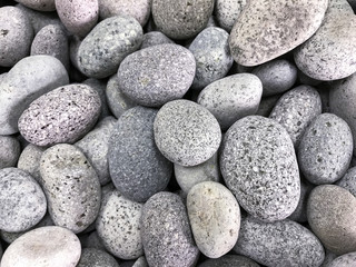 white oval pebbles with Granite-like texture