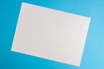 white torn paper with blue background, ready for design