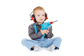 Little boy plays with tools. isolated over white.