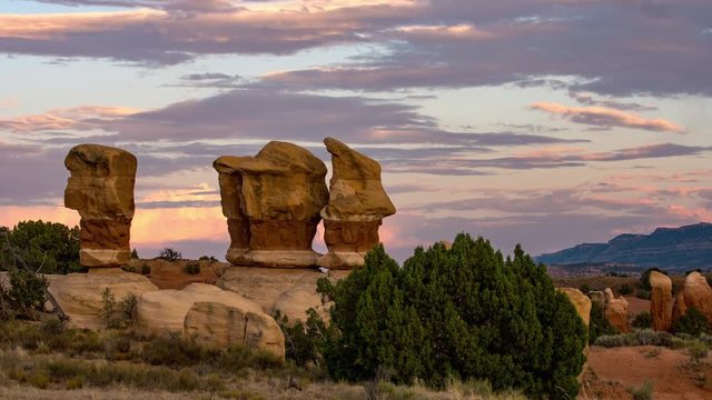 Sunset time lapse looking over rock formations in the desert of Escalante Utah