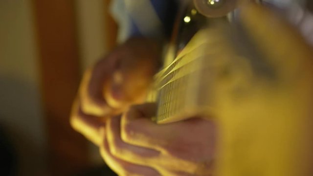 Guitarist plays solo by electric guitar distortion overdrive at the studio