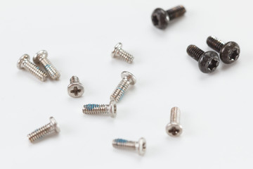 close up metal screws on white background.
