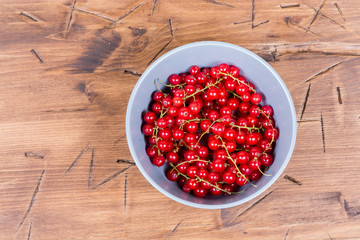 red currants on a wooden