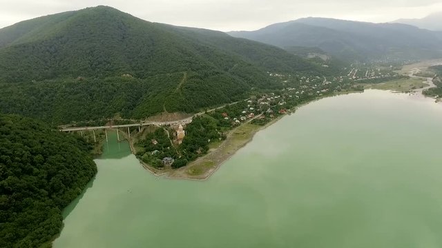 Gergeti, GEORGIA Aerial view of Gergeti Trinity Church, Tsminda Sameba near Gergeti, Georgia. Camera flies on drone above mountains and church