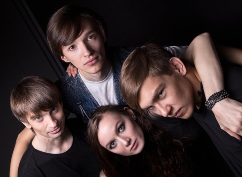 Photo of hugging four friends from top
