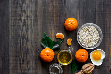 Sweet summer breakfast. Oatmeal, oranges, honey, sugar on wooden table background top view copyspace