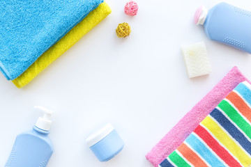 Personal care. Towels, soap and shampoo, cream on white backgrond top view copyspace