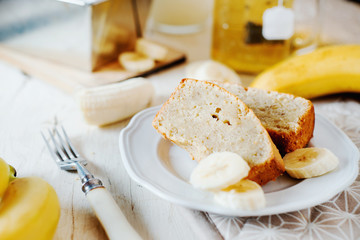 Sweets, desserts and pastries, banana bread or pcake with fresh fruits, milk and green tea on a light background