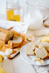 Sweets, desserts and pastries, banana bread or pcake with fresh fruits, milk and green tea on a light background