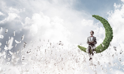 Young businessman or student studying the science and symbols fl