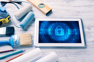 Web security and technology concept with tablet pc on wooden tab © adam121