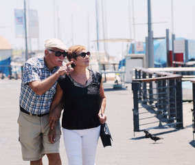 Fototapeta premium Portrait of senior couple walking outdoors