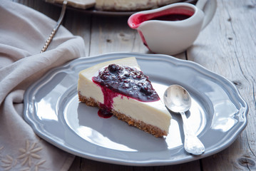 Homemade cheesecake with berry sauce