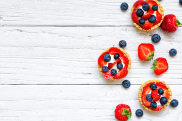 Fresh berry tarts with strawberry and blueberry with fresh berries