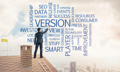 Young businessman standing on house roof and writing leadership 