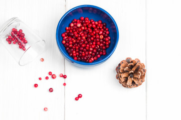 Top flat view: cranberries on white surface