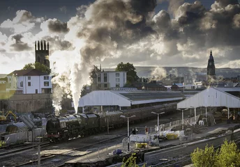Fotobehang The Steam Engine Duchess of Sutherland Stams out of Bolton Station. © John