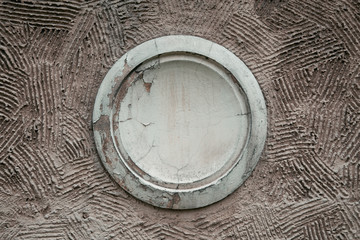 Close-up of decorative gray outlet on the house can be used for labels and signs. Decorative wall panel, antique furniture vintage home. Element façade