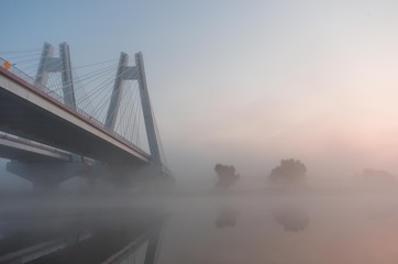 Cable stayed bridge, Krakow, Poland, in the morning fog over Vistula river