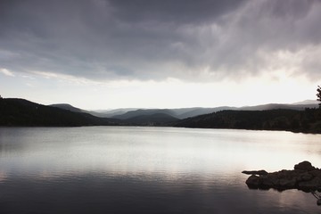 Fototapeta premium Foggy mountains at sunset