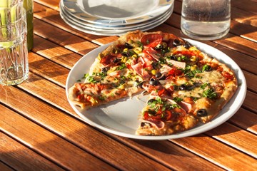 Domestic production of pizza. Preparing food for guests. Pizza party.