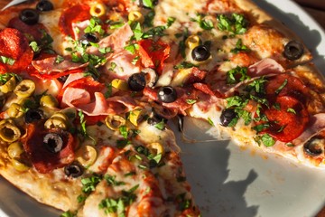 Domestic production of pizza. Preparing food for guests. Pizza party.