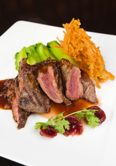 Flame grilled ,rare kangaroo steak loin, served with pak choi and a red wine sauce
