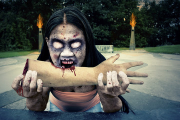 Evil Zombie Monster Eating Arm