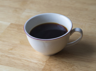 cup of coffee on the wooden desk