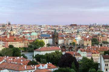 View of buildings at the Mala Strana (Lesser Town) and Old Town districts and beyond in Prague, Czech Republic.